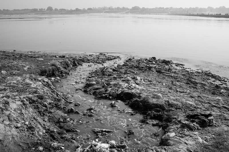 A channel conveying untreated sewage into river Ganga in Varanasi, Uttar Pradesh